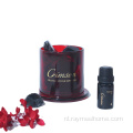 kristalsteen diffuser in rode glazen pot